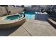 Backyard pool and spa area featuring a concrete deck and outdoor seating at 2707 Gardenia Flower Ave, North Las Vegas, NV 89031