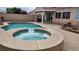 Relaxing backyard featuring a private pool, hot tub, and well-kept patio at 2707 Gardenia Flower Ave, North Las Vegas, NV 89031