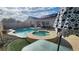Backyard pool with spa, desert landscaping, patio, solar panels, and covered patio at 2707 Gardenia Flower Ave, North Las Vegas, NV 89031