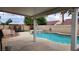 Inviting backyard features a sparkling pool, spa, and covered patio area at 2707 Gardenia Flower Ave, North Las Vegas, NV 89031