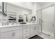 Bathroom featuring double vanity, modern fixtures, and glass-enclosed shower at 288 Whitney Crest St, Henderson, NV 89015