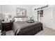 Bright bedroom with a comfortable bed, side tables, a modern lamp, and closet with organizers at 288 Whitney Crest St, Henderson, NV 89015
