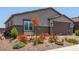 Charming home exterior showcasing desert landscaping, a two-car garage, and a welcoming facade at 288 Whitney Crest St, Henderson, NV 89015