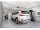 Well-organized garage with epoxy floors, custom storage cabinets, and ample space for parking at 288 Whitney Crest St, Henderson, NV 89015