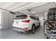 Organized garage featuring epoxy floors, custom storage cabinets and overhead storage at 288 Whitney Crest St, Henderson, NV 89015