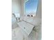 Bright bathroom showcasing a modern soaking tub with gold trim against a marble tiled wall at 2891 S Rainbow Ave, Pahrump, NV 89048