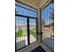 View through secure wrought iron gate and the front entrance at 2891 S Rainbow Ave, Pahrump, NV 89048