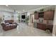 Living room features wet bar, fireplace and view of comfortable seating area at 2891 S Rainbow Ave, Pahrump, NV 89048