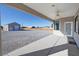 Expansive backyard features a covered patio, gravel landscape, and unobstructed views at 3580 Prairie Ave, Pahrump, NV 89048