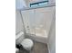 Clean bathroom with white tile shower-tub combination, toilet, and neutral wall color at 3580 Prairie Ave, Pahrump, NV 89048