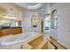 Lavish bathroom featuring a soaking tub and vanity at 3580 Prairie Ave, Pahrump, NV 89048