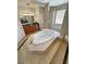 A bathroom with a soaking tub and a vanity at 3580 Prairie Ave, Pahrump, NV 89048