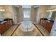 Elegant bathroom featuring dual vanities, marble counters, and soaking tub at 3580 Prairie Ave, Pahrump, NV 89048