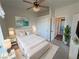 Bright bedroom features a ceiling fan, sliding door closet and a stylish decor at 3580 Prairie Ave, Pahrump, NV 89048