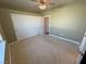 Neutral bedroom with ceiling fan, carpet flooring and sliding closet doors at 3580 Prairie Ave, Pahrump, NV 89048