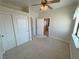 Comfortable bedroom featuring carpet, a ceiling fan, and a sliding door closet at 3580 Prairie Ave, Pahrump, NV 89048