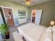 Relaxing bedroom with green walls and an ensuite bathroom and hall entry at 3580 Prairie Ave, Pahrump, NV 89048