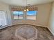 Cozy dining area features tiled flooring and scenic outdoor views from the windows at 3580 Prairie Ave, Pahrump, NV 89048