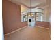 Spacious dining room with hanging lights, connects to a living area with fireplace at 3580 Prairie Ave, Pahrump, NV 89048