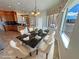 Inviting dining area with elegant marble table and views of the outdoors from the nearby windows at 3580 Prairie Ave, Pahrump, NV 89048