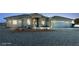 Eye-catching single story home featuring a three car garage, desert landscaping, and ample parking at 3580 Prairie Ave, Pahrump, NV 89048