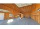 Large garage interior showing open framing, concrete flooring, lift, and significant room for storage and projects at 3580 Prairie Ave, Pahrump, NV 89048