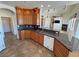 Charming kitchen with granite counters, tile floors, and seamless access to the living room at 3580 Prairie Ave, Pahrump, NV 89048
