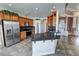 Spacious kitchen with stainless steel appliances, granite counters, and tile flooring at 3580 Prairie Ave, Pahrump, NV 89048