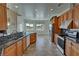 Well-equipped kitchen with granite countertops, tile floors, stainless appliances, and scenic views at 3580 Prairie Ave, Pahrump, NV 89048