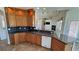 Charming kitchen with granite counters, tile floors, and seamless access to the living room at 3580 Prairie Ave, Pahrump, NV 89048