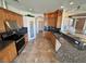 Well-equipped kitchen with granite countertops, stainless appliances, tile floors, and pantry at 3580 Prairie Ave, Pahrump, NV 89048