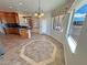 Bright kitchen boasts granite counters, tile floors, stainless appliances, and views of the backyard at 3580 Prairie Ave, Pahrump, NV 89048