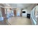Spacious living room with tile floors, fireplace, large windows, and open layout at 3580 Prairie Ave, Pahrump, NV 89048