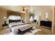 Beautifully decorated main bedroom featuring a luxurious bed, accent furniture, and a calming color scheme at 3580 Prairie Ave, Pahrump, NV 89048