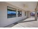 Covered back patio provides ample space for outdoor seating, offering a serene view of the backyard at 3580 Prairie Ave, Pahrump, NV 89048