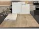 Beautiful interior materials feature white cabinets, a brushed nickel faucet, and vinyl plank flooring at 3871 Riley Rose Ave, Las Vegas, NV 89139