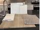 Beautiful interior materials feature white cabinets, a chrome faucet, and vinyl plank flooring at 3871 Riley Rose Ave, Las Vegas, NV 89139