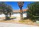 Nice single-story home with a tree-lined front yard and an inviting facade and mature trees at 4329 Studio St, Las Vegas, NV 89115