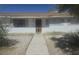 Charming single-story home featuring a well-lit front entrance and a quaint, inviting walkway at 4329 Studio St, Las Vegas, NV 89115