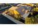 Aerial view of backyard with covered patio, manicured landscaping and privacy fence at 437 Via Stretto Ave, Henderson, NV 89011