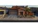 Front exterior shot of a single-story home, featuring desert landscaping at 437 Via Stretto Ave, Henderson, NV 89011
