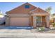 Charming single-story home featuring a two-car garage and a cozy front porch at 437 Via Stretto Ave, Henderson, NV 89011
