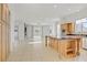 Spacious, bright kitchen offers ample storage, center island, stainless steel appliances, and seamless flow to living area at 437 Via Stretto Ave, Henderson, NV 89011