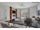 Spacious room with fireplace, built-ins, and a sleek marble table set, perfect for modern living at 437 Via Stretto Ave, Henderson, NV 89011