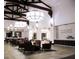 Well-lit lobby showcasing stylish seating, ceiling beams and 'Tuscany' signage at 437 Via Stretto Ave, Henderson, NV 89011