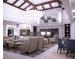 Comfortable lounge with fireplace, open shelving, and stylish decor at 437 Via Stretto Ave, Henderson, NV 89011