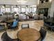 View of lounge area featuring round tables and stylish seating near the fireplace at 437 Via Stretto Ave, Henderson, NV 89011