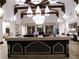 View of the reception desk with decorative wood and marble accents at 437 Via Stretto Ave, Henderson, NV 89011