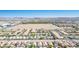 Expansive aerial view of the neighborhood, showcasing the residential area with desert views and mountains at 4529 Gracemont Ave, Las Vegas, NV 89139
