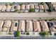 An aerial view of a community showcasing similar homes and a flood basin at 4529 Gracemont Ave, Las Vegas, NV 89139